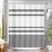 Shower curtain with black wavy stripes in a bathroom setting
