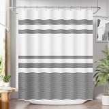 Shower curtain with black wavy stripes in a bathroom setting