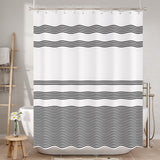 Shower curtain with black wavy stripes in a bathroom setting