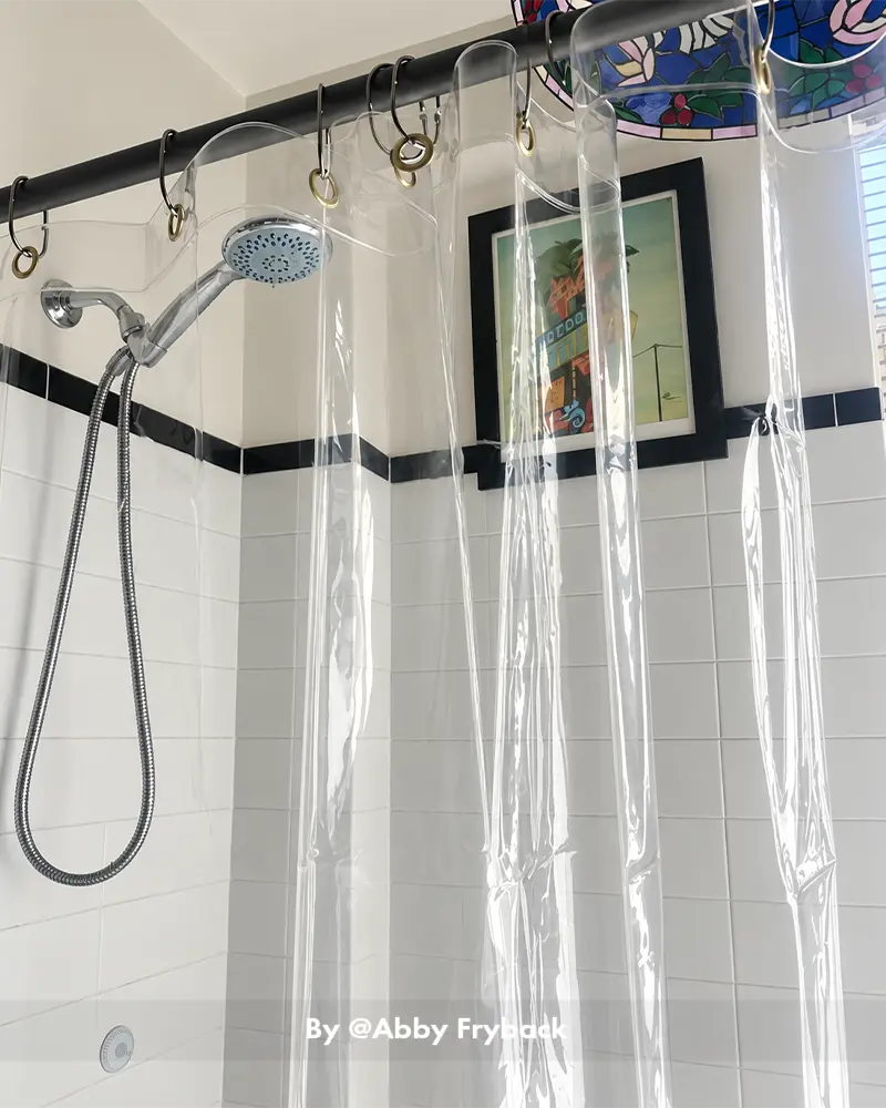 AmazerBath Sun EVA shower curtain liner hanging in a real bathroom, showing smooth waterproof coverage around the tub