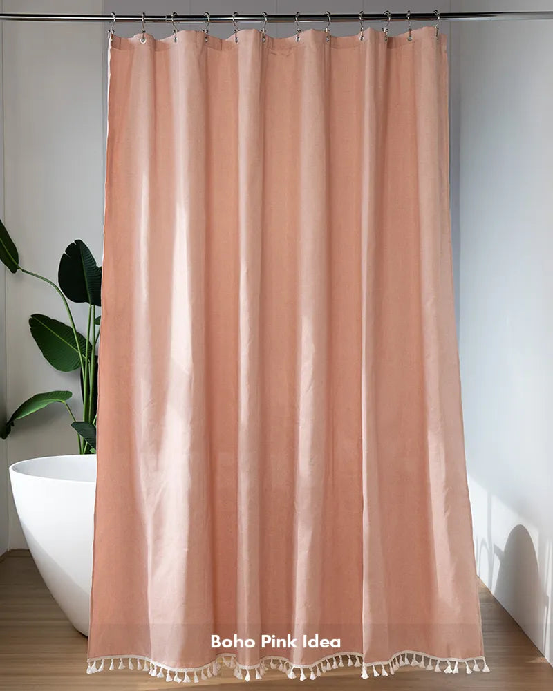 Customer bathroom photo showing a pink boho tassel shower curtain, with its decorative tassels and curtain design visible.