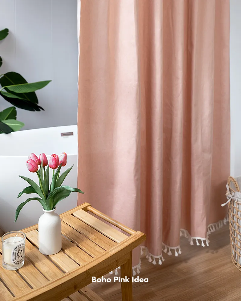Customer bathroom photo showing a pink boho tassel shower curtain, with its decorative tassels and curtain design visible.