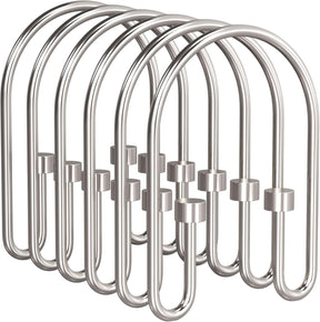 Set of silver shower curtain hooks on a white background