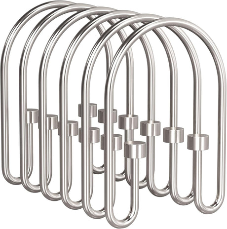 Set of silver shower curtain hooks on a white background