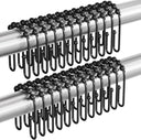 Black curtain hooks on a white background