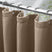 AmazerBath taupe waffle shower curtain in 240 GSM fabric hanging from silver hooks on a bathroom rod.