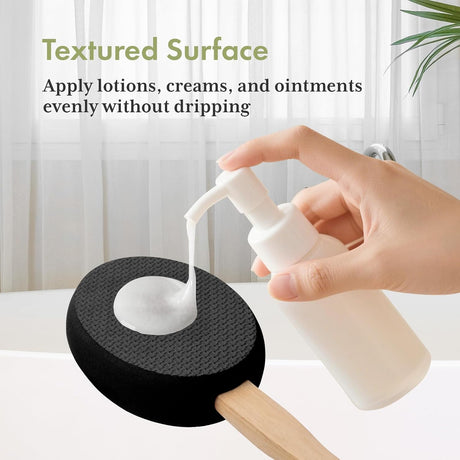 Lotion dispensed onto the textured black EVA pad of the AmazerBath back applicator.