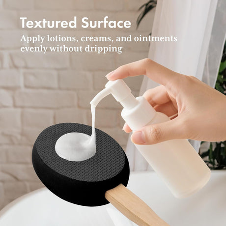 Lotion dispensed onto the textured black EVA pad of the AmazerBath back applicator.