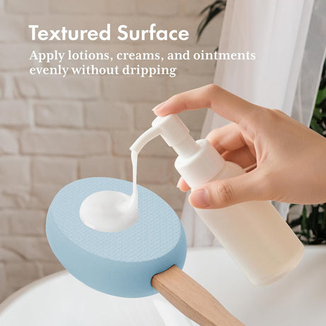 Lotion dispensed onto the textured blue EVA pad of the AmazerBath back applicator.