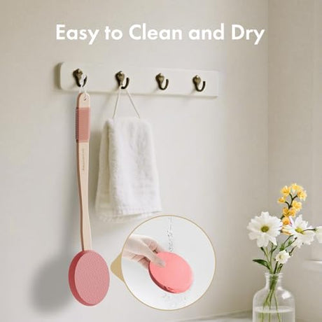 AmazerBath blush pink back lotion applicator hanging to dry after the removable EVA pad is rinsed.