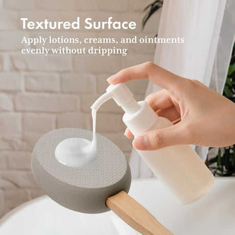 Lotion dispensed onto the textured gray EVA pad of the AmazerBath back applicator.