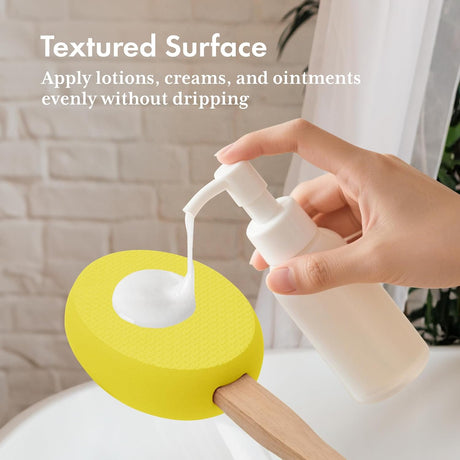 Lotion dispensed onto the textured lemon yellow EVA pad of the AmazerBath back applicator.