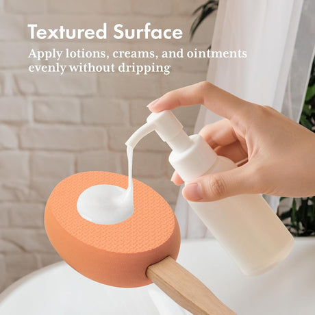 Lotion dispensed onto the textured orange EVA pad of the AmazerBath back applicator.