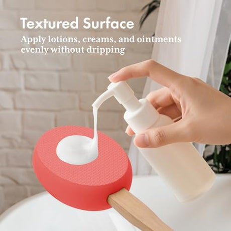 Lotion dispensed onto the textured rose red EVA pad of the AmazerBath back applicator.