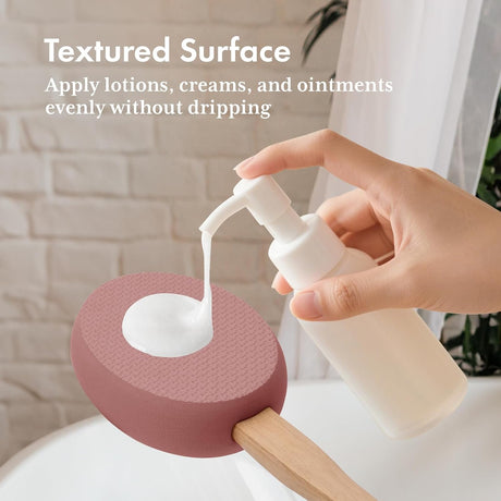 Lotion dispensed onto the textured rosewood EVA pad of the AmazerBath back applicator.