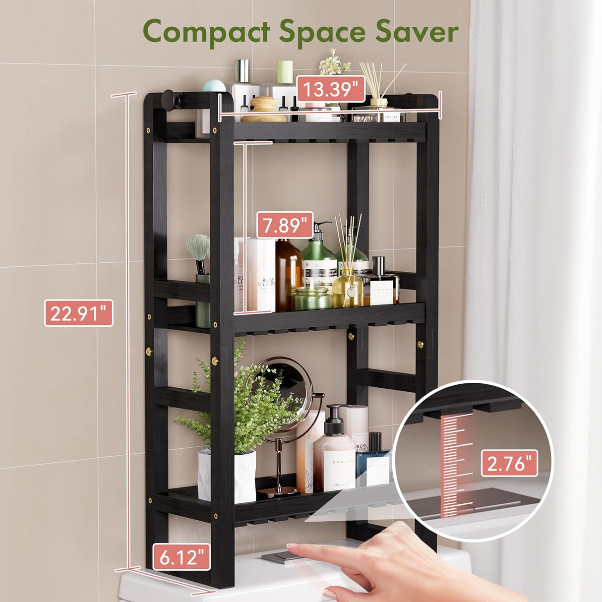 Compact black AmazerBath three-tier over-the-toilet rack measuring 13.39 inches wide and 22.91 inches high.