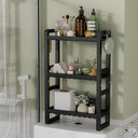 AmazerBath black bamboo three-tier toilet rack holding toiletries, towels and tissue boxes.