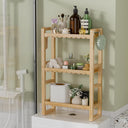 AmazerBath natural bamboo three-tier toilet rack holding toiletries, towels and tissue boxes.