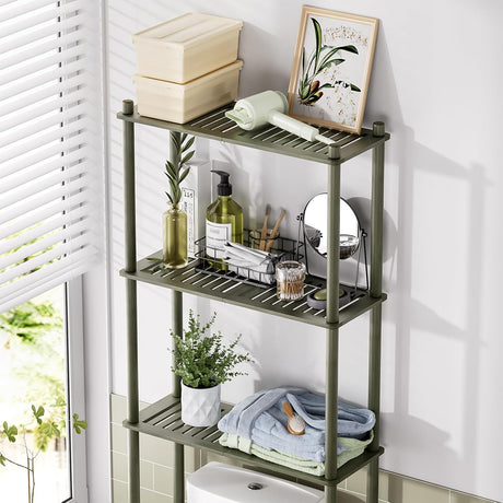 AmazerBath forest bamboo over-the-toilet storage shelf organized with towels, toiletries, and decor.