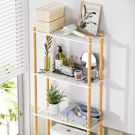 AmazerBath white & natural bamboo over-the-toilet storage shelf organized with towels, toiletries, and decor.