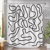 Black abstract line-art AmazerBath shower curtain fully installed over a white bathtub.
