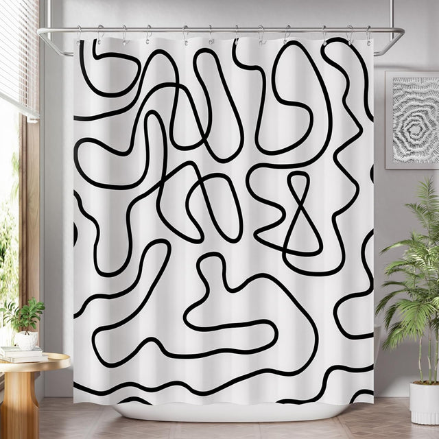 Black abstract line-art AmazerBath shower curtain fully installed over a white bathtub.