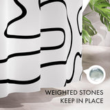 Weighted bottom system on the Black Abstract Shower Curtain with 12 Rings that helps keep it in place.