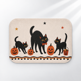 Black cat Halloween bath mat with retro pumpkins and stars on a light gray background