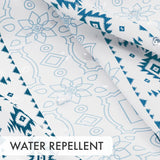 Water beading on the waterproof blue Boho Haven Geometric Shower Curtain with 12 Rings.
