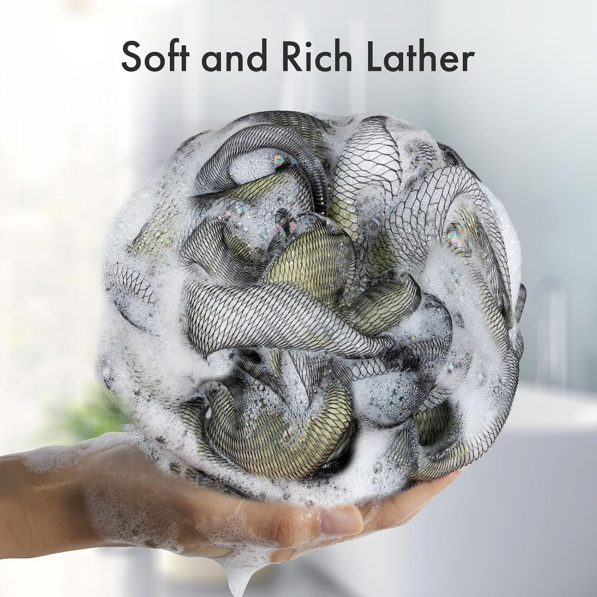 Dense, soft mesh on the Charcoal Exfoliating Loofah Sponges, Set of 4 in grey creating a rich lather.