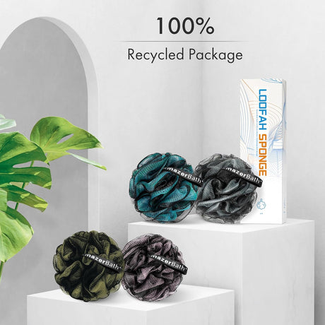 AmazerBath four charcoal loofah sponges in grey, green and teal displayed with recyclable packaging.