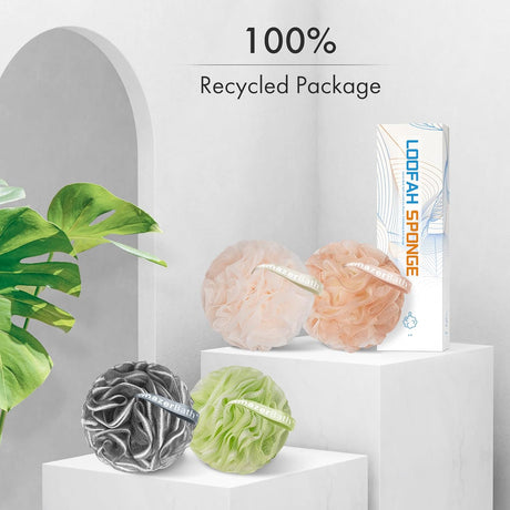 AmazerBath melon charcoal loofah sponge set in peach, green and grey displayed with recyclable packaging.