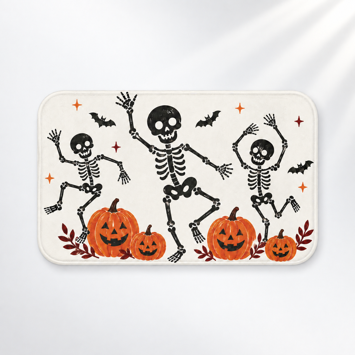 Dancing skeleton Halloween bath mat with playful orange pumpkins on a light gray background