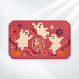 Groovy ghost Halloween bath mat with a disco ball and pumpkins on a light gray background