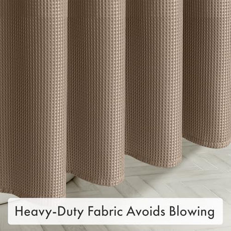 Heavy-duty AmazerBath taupe waffle shower curtain hanging smoothly to help reduce billowing in the bathroom.