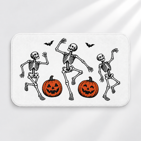 Linocut skeleton Halloween bath mat with dancing bones and pumpkins on a light gray background