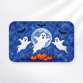 Moonlit ghosts Halloween bath mat with a blue moon and pumpkins on a light gray background