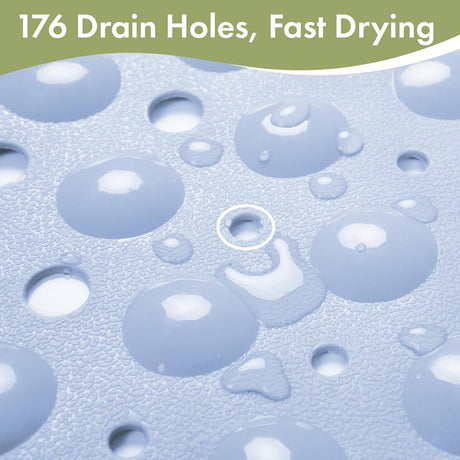 Close-up of the blue AmazerBath bathtub mat showing 176 drain holes for fast water drainage.