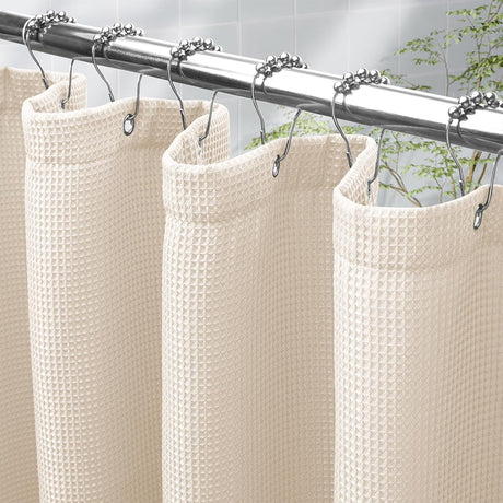 Close-up of the shiny white AmazerBath waffle shower curtain texture, reinforced top hem, and metal grommets.