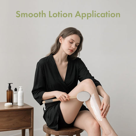 AmazerBath Grey back lotion applicator used to spread lotion evenly across a woman's lower leg.