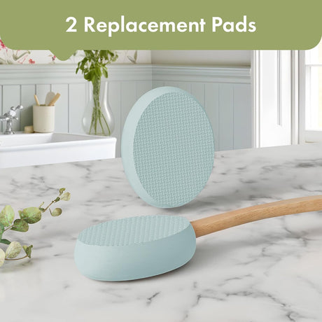 AmazerBath Sky Blue back lotion applicator with two oval replacement pads displayed on a bathroom countertop.
