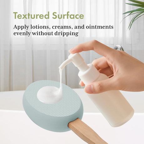 AmazerBath Sky Blue back lotion applicator pad holding dispensed lotion on its textured surface without dripping.