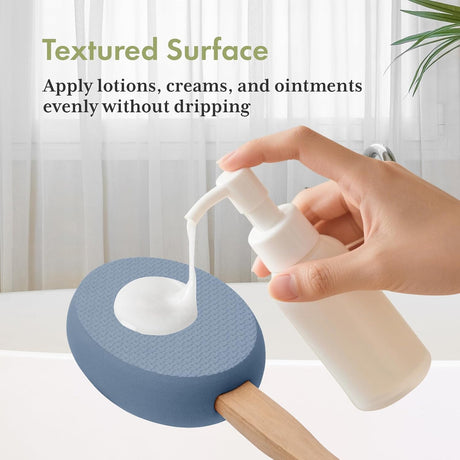 AmazerBath Slate Blue back lotion applicator pad holding dispensed lotion on its textured surface without dripping.