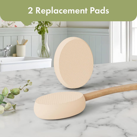 AmazerBath Soft Beige back lotion applicator with two oval replacement pads displayed on a bathroom countertop.