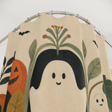 Close-up of Boho Ghosts & Pumpkins Halloween Shower Curtain fabric, print, and buttonholes