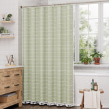 AmazerBath sage green grid linen curtain: the grid curtain hangs beside a bright window with its tassel hem visible.