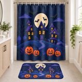 Moonlit Haunted Village Halloween Shower Curtain and matching Halloween bath mat displayed together in a bathroom
