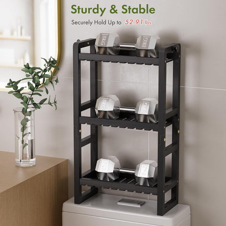 AmazerBath Black bamboo over-the-toilet rack supporting dumbbells across three shelves to demonstrate its 52.91-pound capacity.