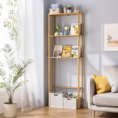 AmazerBath Natural bamboo three-tier over-the-toilet shelf styled beside a sofa with books, baskets, plants, and decor.