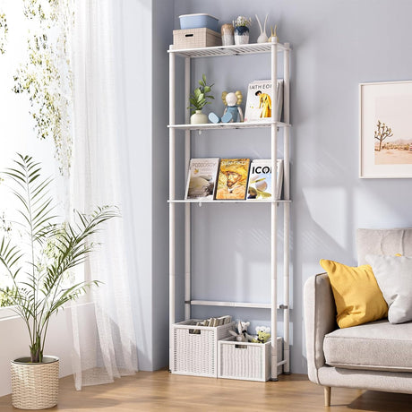 AmazerBath White bamboo three-tier over-the-toilet shelf styled beside a sofa with books, baskets, plants, and decor.